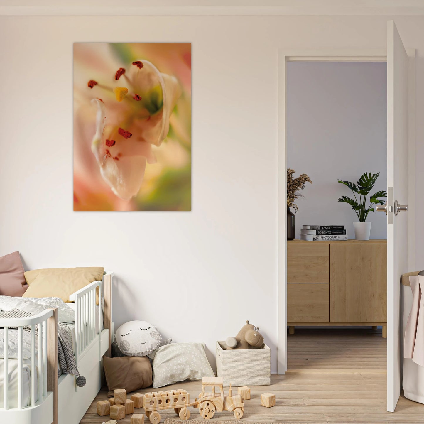 Close-up soft pink lily with red stamens and yellow pistil against a dreamy green and rose bokeh background, botanical art children's room