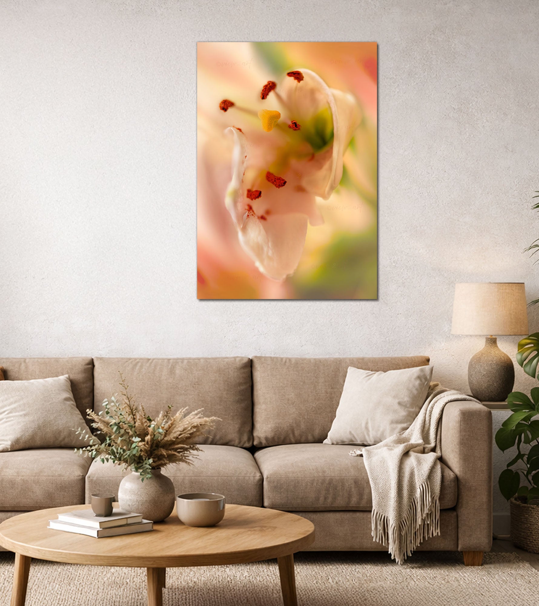Close-up soft pink lily with red stamens and yellow pistil against a dreamy green and rose bokeh background, modern living room